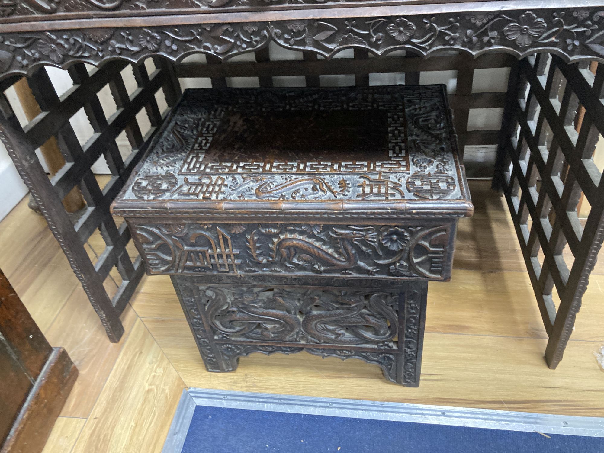 A Chinese carved hongmu folding table, width 83cm depth 56cm height 67cm, and a similar stool/stand, early 20th century
